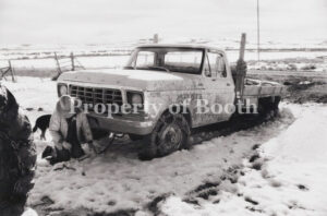 © Barbara Van Cleve, Melody Harding, Chaining Up a Stuck Truck, Bar Cross Ranch, Old Piney, WY, 1987, Pigment Print, 12.7" x 19.2", PH2019.001.019, Museum Purchase