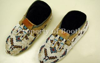 Beaded moccasins, c. 1890, the right shoe: 2.37 (h) x 3.75 (w) x 9.75" (length) the left shoe: 2.50 (h) x 3.87 (w) x 9.75" (length)